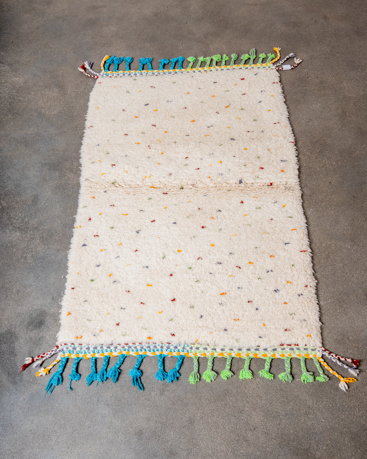 Modern, designer, handcrafted Berber rug from Morocco. Beniourain carpet with beautiful colours and patterns and fluffy wool texture.